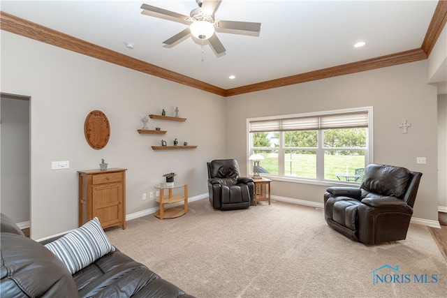 carpeted living room with ceiling fan and crown molding