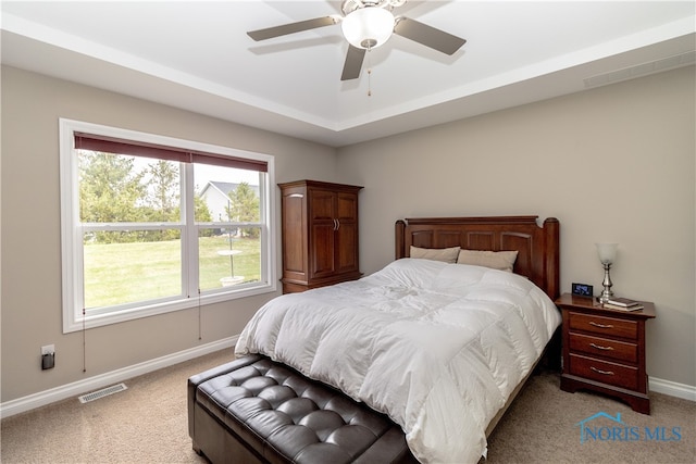 bedroom with light carpet and ceiling fan