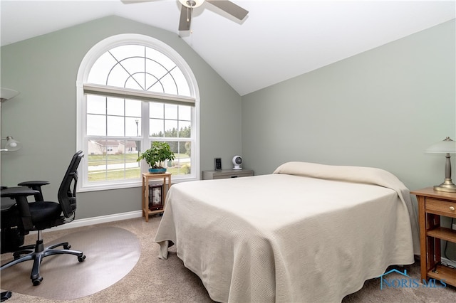 bedroom with carpet, multiple windows, ceiling fan, and vaulted ceiling