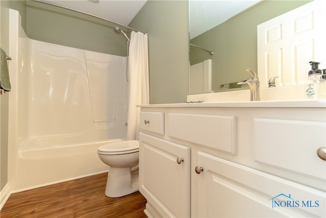 full bathroom with shower / bath combo, wood-type flooring, toilet, and vanity