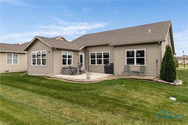 back of property featuring a patio area and a yard