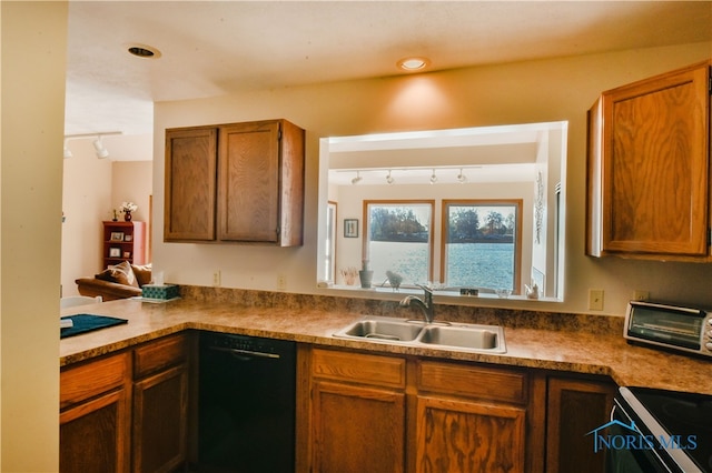 kitchen with sink, track lighting, and black dishwasher