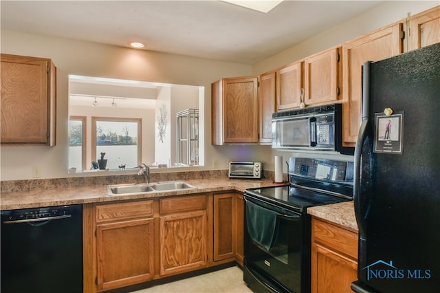 kitchen with black appliances and sink