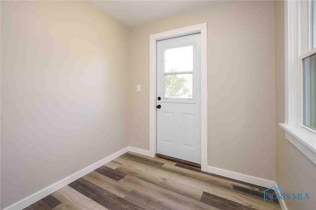 doorway to outside with light hardwood / wood-style flooring