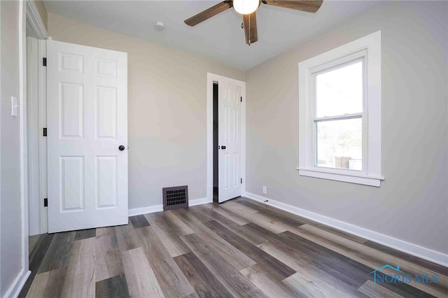 unfurnished bedroom with hardwood / wood-style floors and ceiling fan