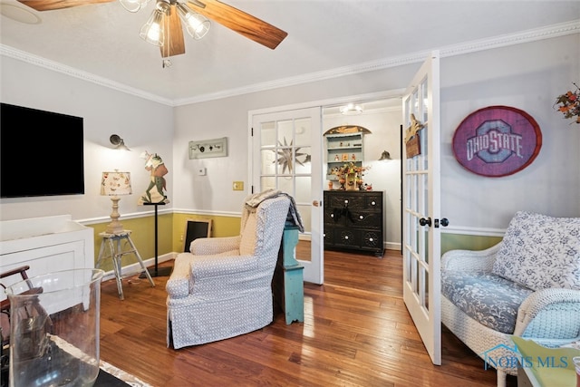 living room featuring hardwood / wood-style floors, french doors, ceiling fan, and crown molding