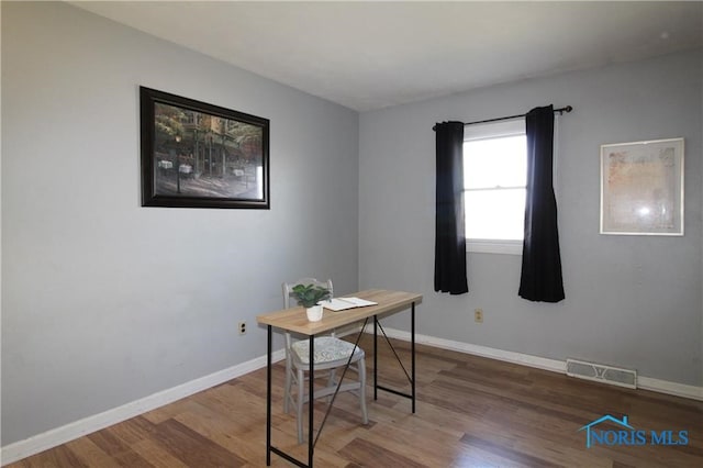 home office featuring hardwood / wood-style flooring