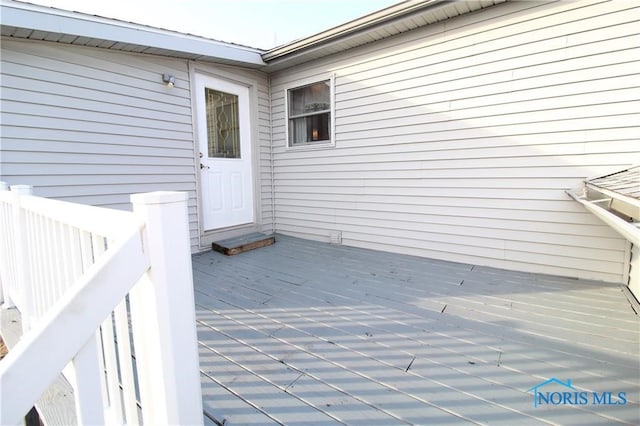 doorway to property with a deck