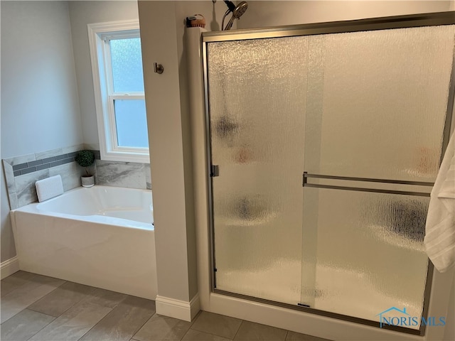 bathroom featuring separate shower and tub