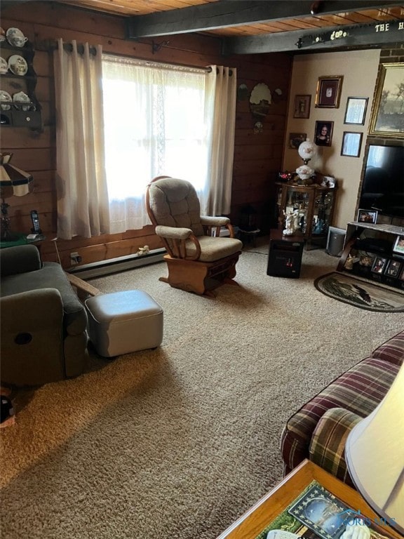 living room with carpet flooring, a baseboard heating unit, wooden walls, and beam ceiling