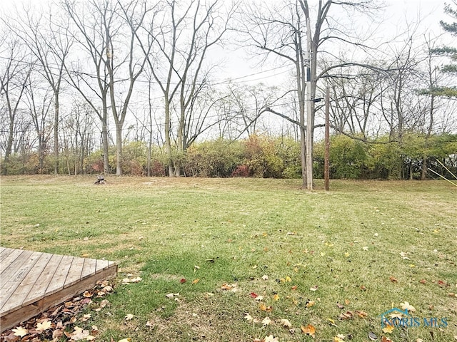 view of yard with a wooden deck