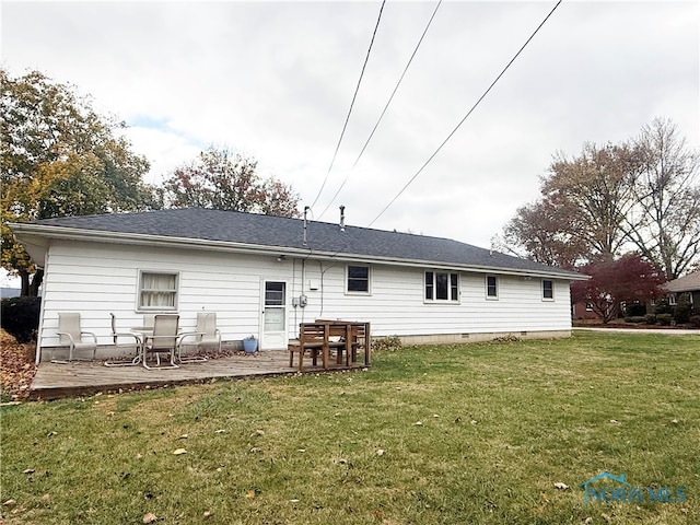 rear view of house with a patio area and a yard