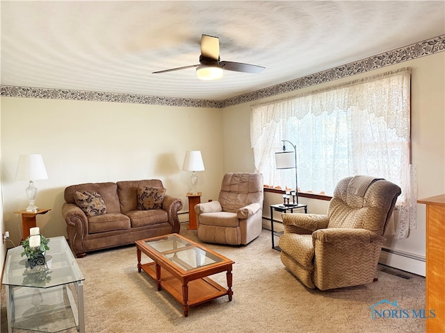 living room with carpet, baseboard heating, and ceiling fan