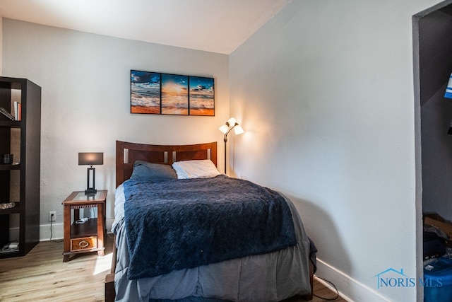 bedroom with light hardwood / wood-style floors