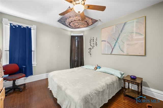 bedroom featuring dark wood-type flooring and ceiling fan