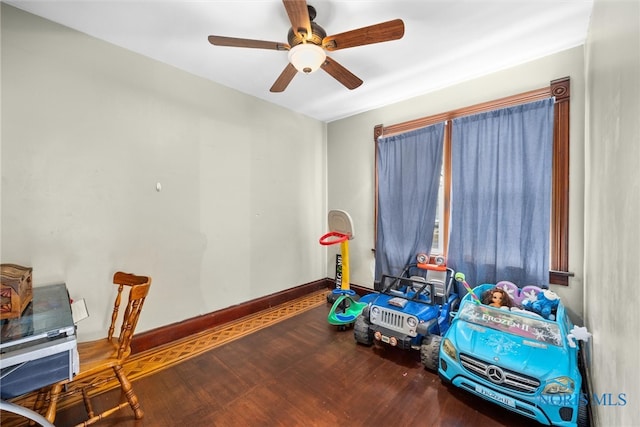 recreation room with hardwood / wood-style floors and ceiling fan