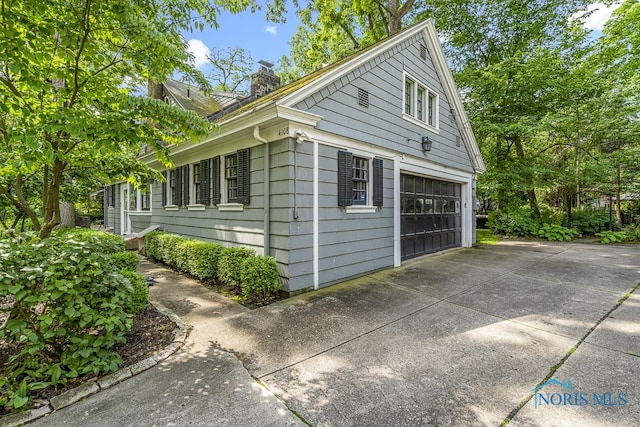 view of property exterior featuring a garage