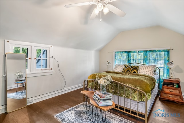 bedroom featuring hardwood / wood-style floors, ceiling fan, and vaulted ceiling