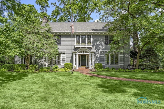 view of front of home with a front yard