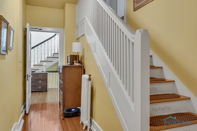 stairway featuring hardwood / wood-style floors