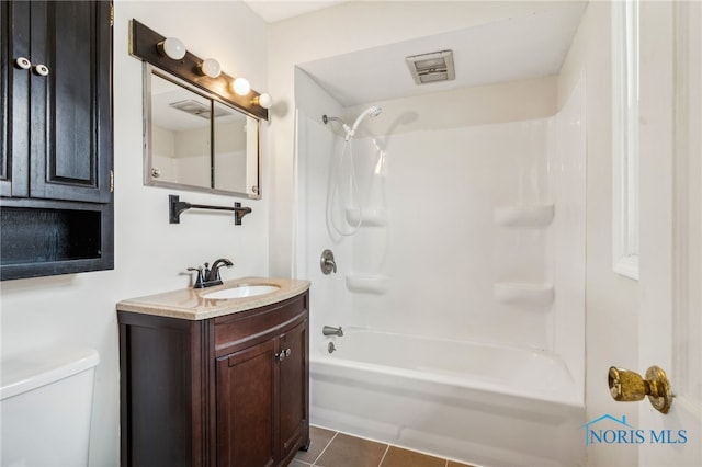 full bathroom with toilet, washtub / shower combination, tile patterned floors, and vanity