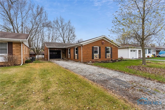 ranch-style home with central air condition unit, a carport, and a front yard