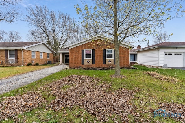 view of front of house featuring cooling unit and a front yard