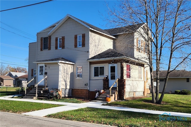 view of property with a front lawn