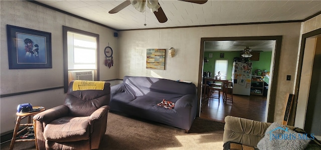 living room with cooling unit, hardwood / wood-style flooring, crown molding, and ceiling fan