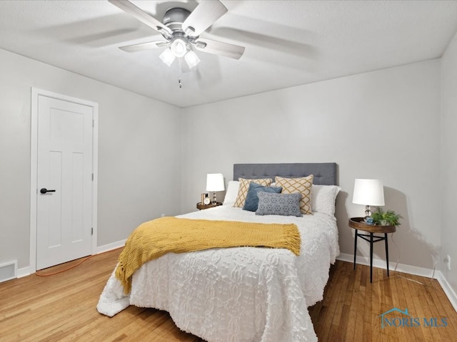 bedroom featuring wood-type flooring and ceiling fan