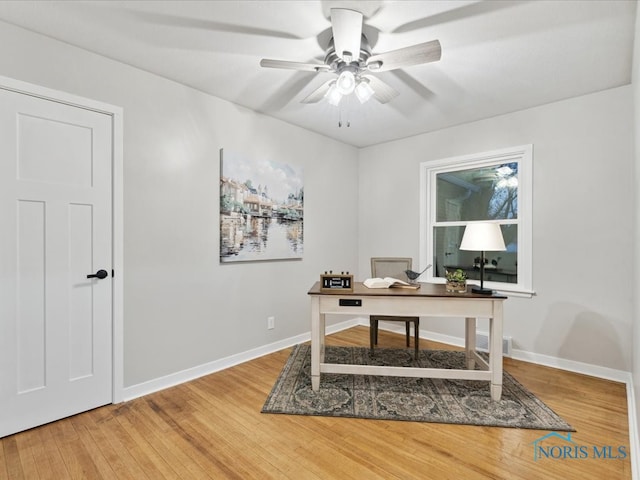 office space with hardwood / wood-style flooring and ceiling fan