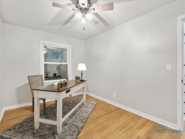 office with hardwood / wood-style floors and ceiling fan