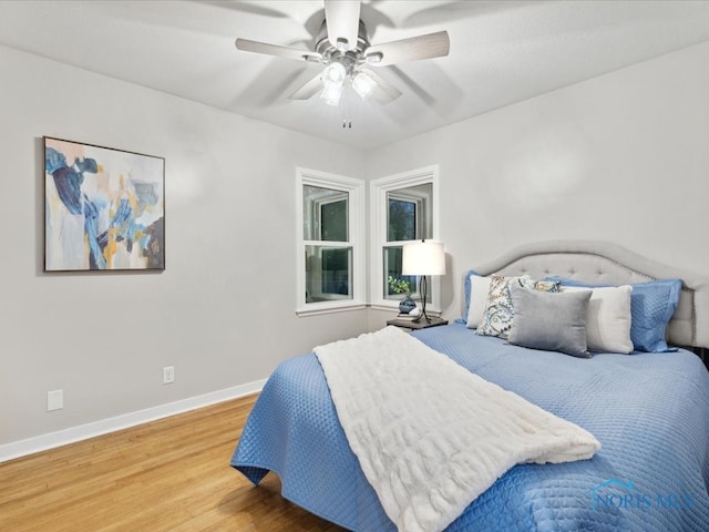 bedroom featuring wood-type flooring and ceiling fan