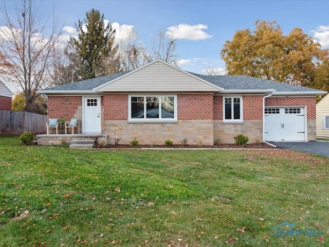 single story home with a garage and a front yard