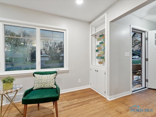 sitting room with light hardwood / wood-style flooring