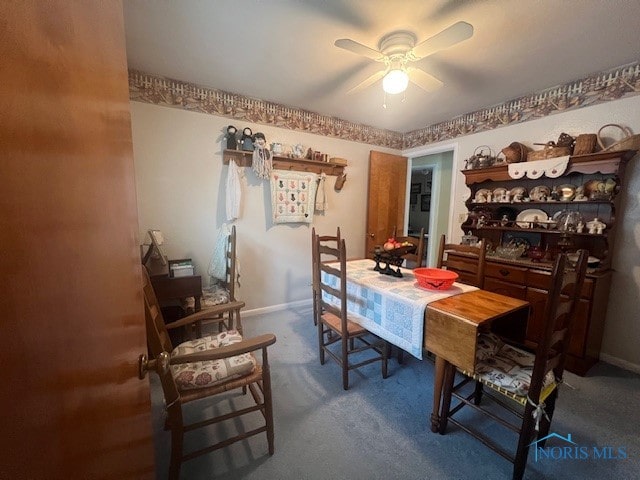 carpeted dining space featuring ceiling fan