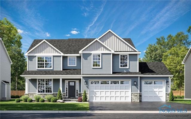 view of front of home featuring a garage and a front lawn