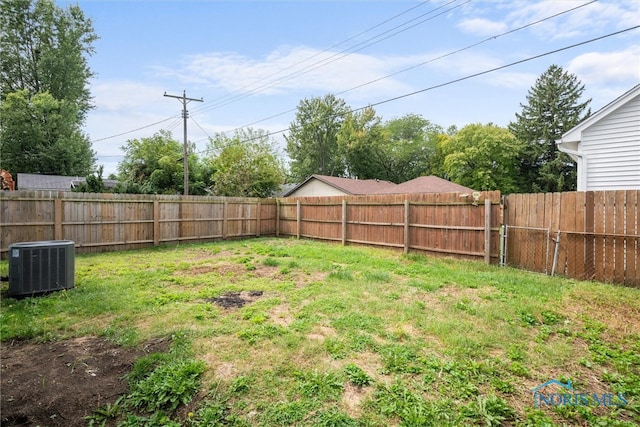 view of yard with central AC unit