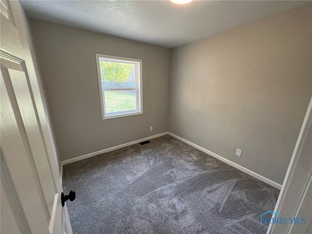 unfurnished room featuring carpet flooring