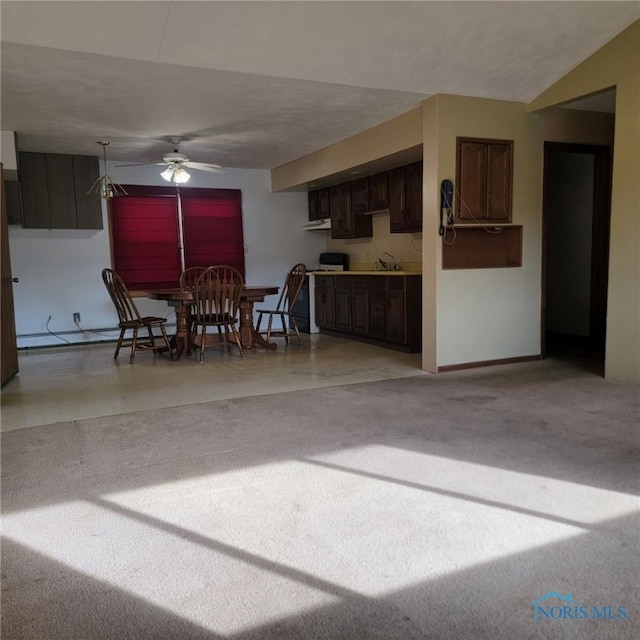 interior space featuring lofted ceiling, a textured ceiling, and ceiling fan