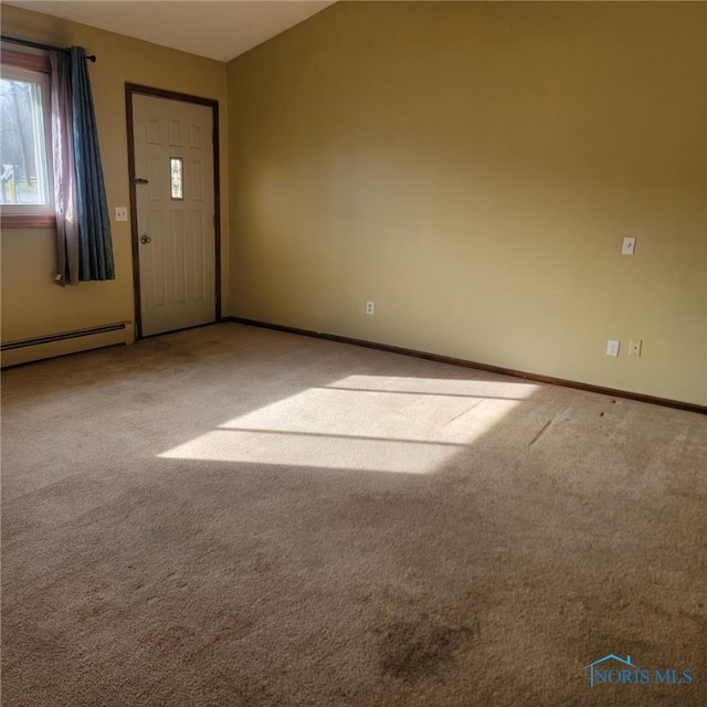 entrance foyer with a baseboard radiator and carpet flooring