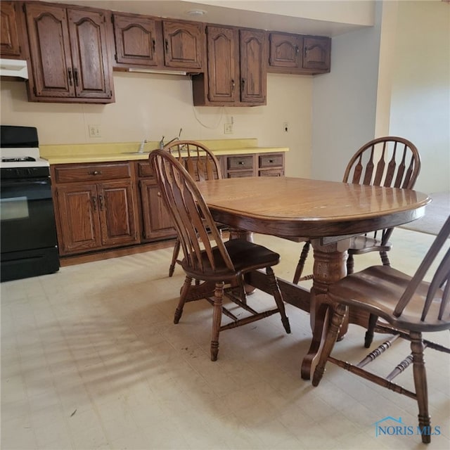 kitchen with white gas range oven