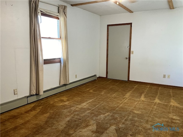 carpeted spare room with a baseboard heating unit