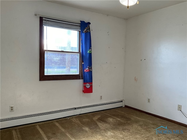 empty room with a baseboard radiator and dark colored carpet