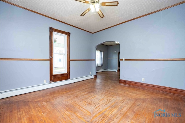 unfurnished room featuring a baseboard heating unit, a textured ceiling, ornamental molding, ceiling fan, and parquet flooring