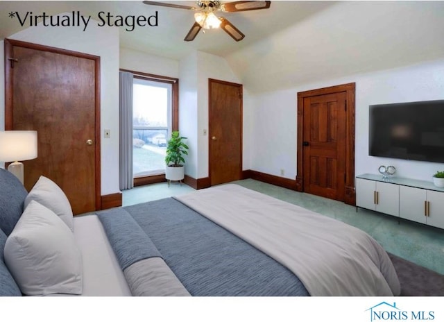 carpeted bedroom with lofted ceiling and ceiling fan