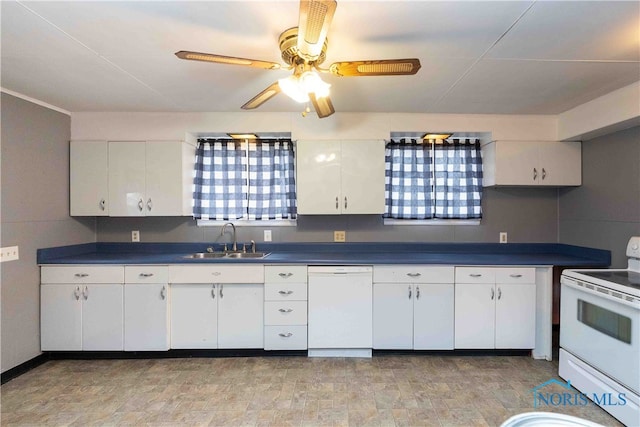 kitchen featuring white cabinetry, sink, and white appliances