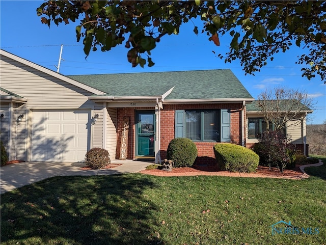 single story home with a garage and a front yard