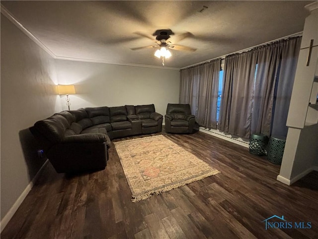 living room featuring crown molding, dark hardwood / wood-style floors, and ceiling fan