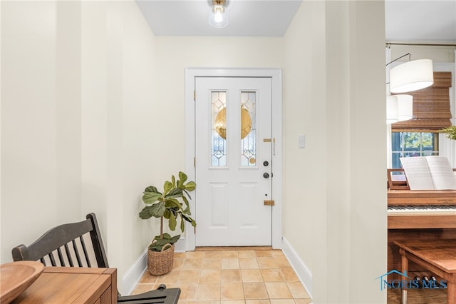 foyer entrance featuring light tile patterned floors